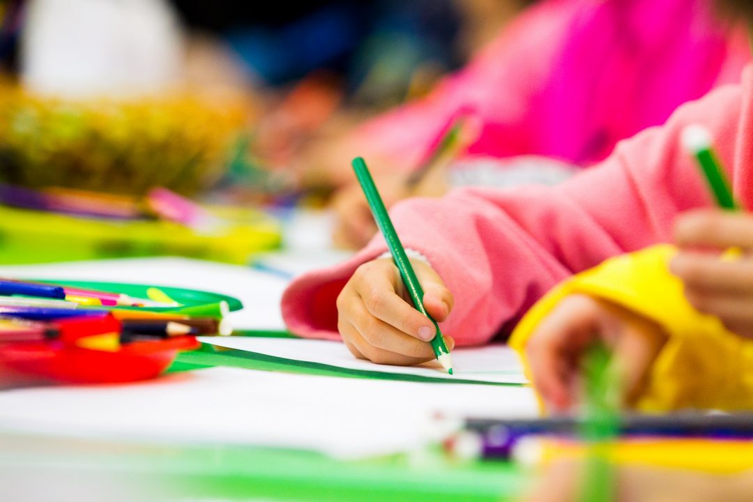 Pencil in the child's hand