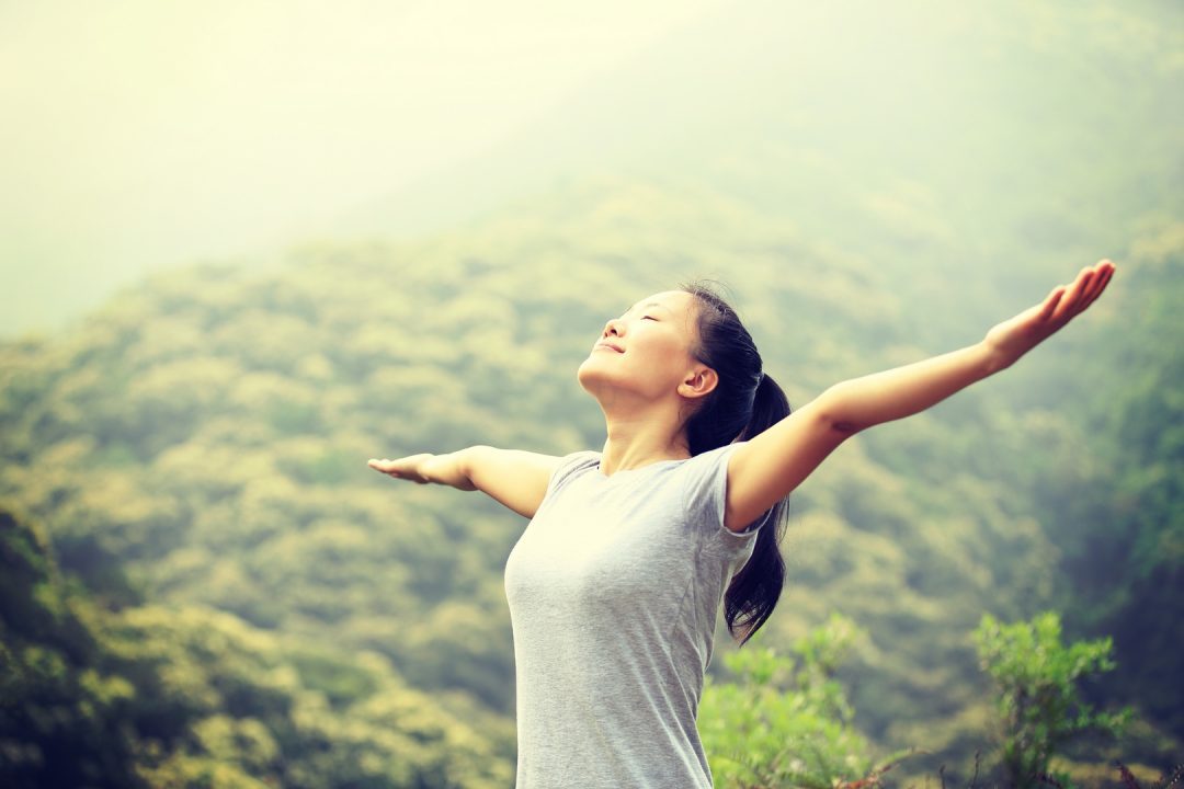 young-asian-woman-breathing-fresh-air-in-spring-na-PQKWLGR (1) (Copier)